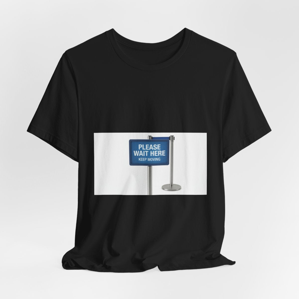 Please Wait Here Keep Moving design on a Sort Of Ish unisex tee, black, hanging